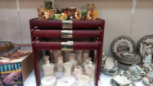 A mahogany nest of tables with glass tops. COLLECT ONLY