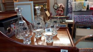 A boxed set of 4 Dartington glasses and 2 decanters