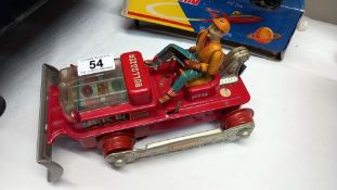 A Japanese tinplate battery operated 'TN' 'Nomura' no.642 bulldozer length 24cm