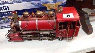 A pressed steel tinplate model ornament of a steam train length 33cm
