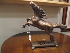 A patinated brass figure of a rearing horse height 31cm