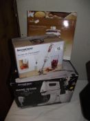 A boxed Silvercrest handmixer set, a hand blender set and tiered cake pans