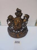 An old brass safe plate made in to a crown.