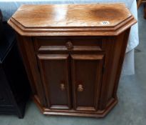 An oak veneered 2 door, 1 drawer cupboard COLLECT ONLY
