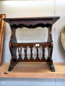 A dark wood stained tea table/magazine rack