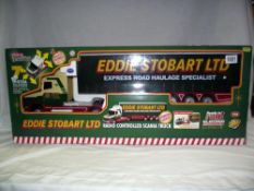 A boxed control freaks Eddie Stobbart 1/18 scale radio controlled Scania truck, box looks sealed