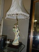 A figural table lamp.