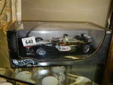 A boxed Hot Wheels McLaren Kimi Raikkonen MP4-17D Formula One car.