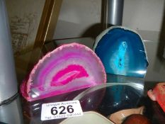 Two pieces of agate geode in pink and turquoise.