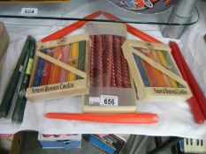 Two packets of natural beeswax candles, a box of nine candles and two others.