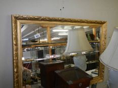 A large gilt framed mirror, 86 x 61 cm.