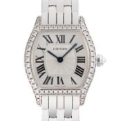 A FINE LADIES 18K SOLID WHITE GOLD & DIAMOND CARTIER TORTUE MECANIQUE BRACELET WATCH CIRCA 2000s,
