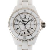A LADIES MEDIUM SIZE WHITE CERAMIC CHANEL J12 BRACELET WATCH CIRCA 2010 ACCOMPANIED BY ITS