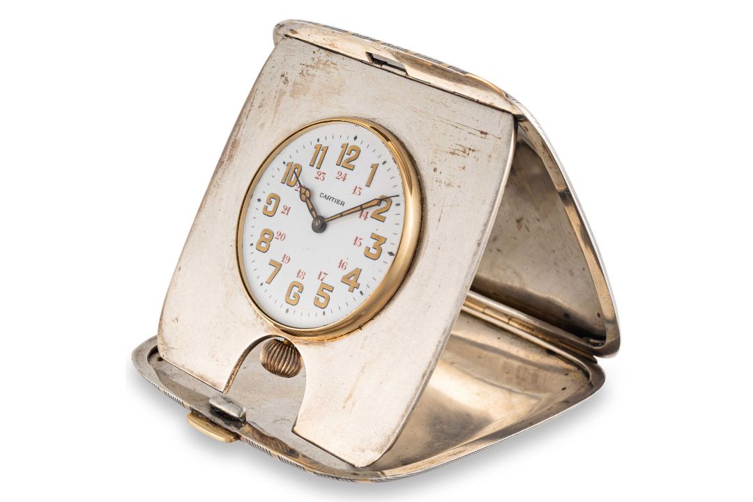 A RARE SOLID SILVER & GOLD CARTIER TRAVEL CLOCK CIRCA 1930, WITH 24 HOUR ENAMEL DIAL, ACCOMPANIED BY - Image 1 of 5