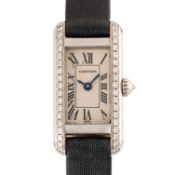 A LADIES 18K SOLID WHITE GOLD & DIAMOND CARTIER TANK MINI ALLONGEE WRIST WATCH DATED 2003, REF. 2525
