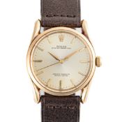 A GENTLEMAN'S SIZE 14K SOLID GOLD ROLEX OYSTER PERPETUAL WRIST WATCH CIRCA 1960, REF. 1010 WITH 