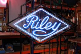 A Riley Motors neon sign,