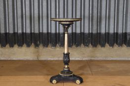 A Regency gilt and ebonised wood and gesso torchère,