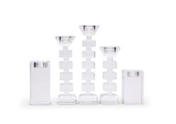 A set of three graduated glass tea light holders and a pair of tea light holders