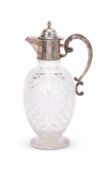An Edwardian cut glass and silver mounted ewer