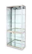 A vintage 1980's chrome and brass vitrine