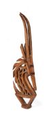 A West African Bamana carved wood and metal headdress in the form of a Chi-Wara