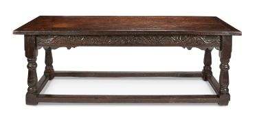A 19th century oak carved refectory table in the 17th century style
