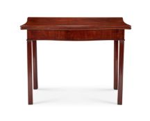 A George III mahogany serpentine tea table