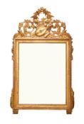 A 19th century French Louis XVI style carved gilt wood mirror