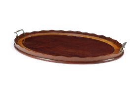 A George III mahogany and satinwood banded oval tray