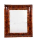 A William & Mary walnut oyster veneered cushion framed mirror