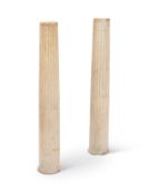 A pair of fluted stop fluted white marble columns