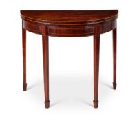 A George III mahogany and tulipwood crossbanded demi-lune card table