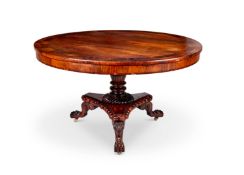 A 19th century Irish carved rosewood and crossbanded centre table