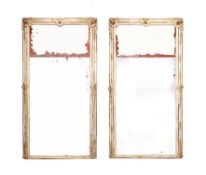 A pair of 19th century French rubbed gesso and gilt wood pier mirrors in the Louis XV style