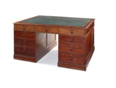 An early Victorian mahogany partner's desk
