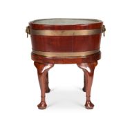 A George III mahogany and brass bound oval wine cooler on later stand