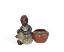 A small cold-painted bronze figure of a boy attributed to Bergmann