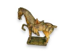 A Chinese Tang style green painted plaster horse