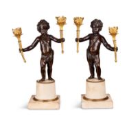 A pair of 19th century gilt bronze and patinated bronze putti candelabra
