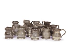 A mixed group of fourteen 18th and 19th century pewter baluster half pint handled tankards