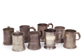 Eight 19th century pewter pint handled tankards