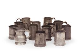 A mixed group of thirteen 18th and 19th century pewter half pint handles tankards