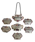 A group of seven late 18th century South Staffordshire enamel decanter labels or bottle tickets