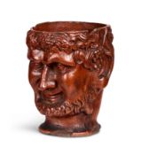 A 19th century terracotta libation cup in the form of the head of Bacchus