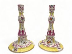 A pair of 18th century German Limbach rose, yellow and gilt porcelain candlesticks