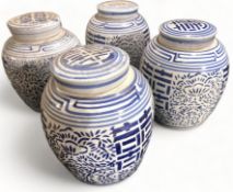 A set of four contemporary Chinese blue and white stoneware jars and covers