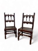 A matched pair of 17th century style Derbyshire carved oak chairs