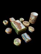 A group of Halcyon Days enamel boxes and a pen pot decorated with Architectural themes and views