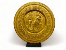A 19th century French gilt bronze relief work circular charger
